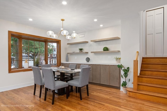 611 S Fern Ave, Elmhurst, IL 60126 - dining room with light wood-type flooring, a chandelier, stairway, recessed lighting, and baseboards