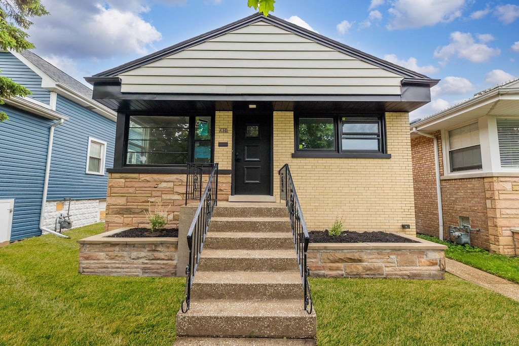 3831 Clarence Ave, Berwyn, IL 60402 - view of front of house featuring a front lawn and brick siding