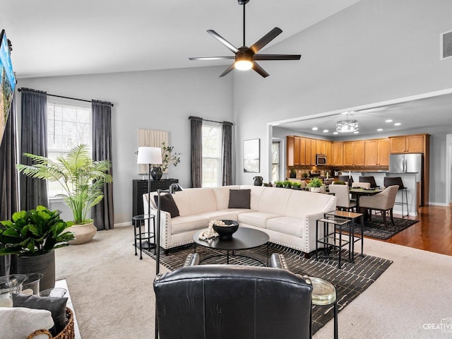 1022 Broadmoor Dr, Elgin, IL 60124 - living area with plenty of natural light, high vaulted ceiling, recessed lighting, ceiling fan, and baseboards