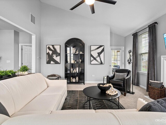 1022 Broadmoor Dr, Elgin, IL 60124 - carpeted living room featuring ceiling fan, baseboards, and high vaulted ceiling