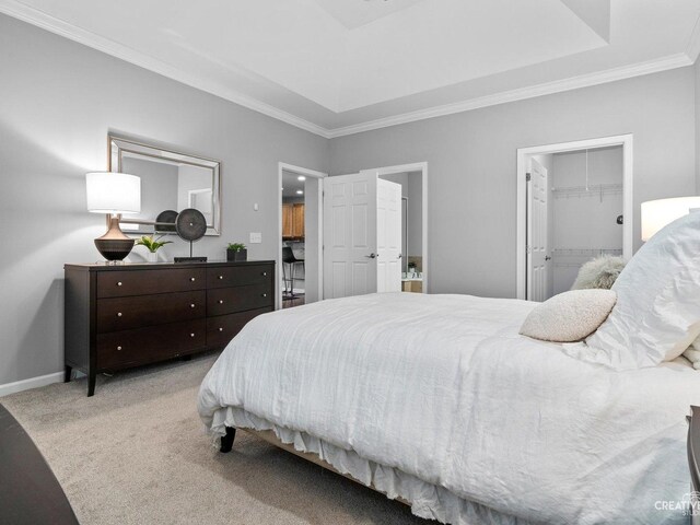 1022 Broadmoor Dr, Elgin, IL 60124 - carpeted bedroom with ornamental molding, baseboards, a spacious closet, and ensuite bath