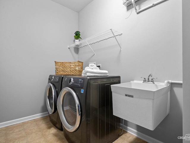 1022 Broadmoor Dr, Elgin, IL 60124 - laundry room with washer and clothes dryer, baseboards, and tile patterned floors