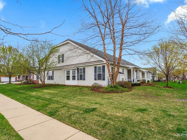 1022 Broadmoor Dr, Elgin, IL 60124 - view of property exterior featuring a yard and metal roof