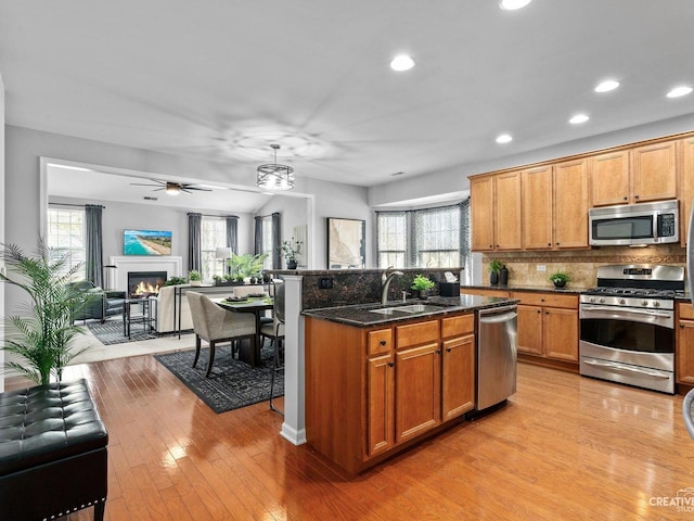 1022 Broadmoor Dr, Elgin, IL 60124 - kitchen featuring appliances with stainless steel finishes, a sink, open floor plan, recessed lighting, and a ceiling fan