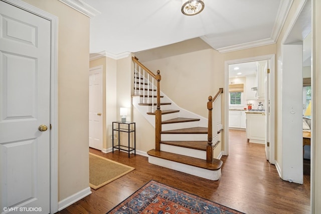706 Tanglewood Ct, Lake Forest, IL 60045 - stairs featuring wood finished floors, ornamental molding, and baseboards