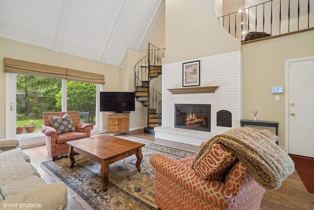 706 Tanglewood Ct, Lake Forest, IL 60045 - living area with high vaulted ceiling, stairs, wood finished floors, beam ceiling, and a fireplace