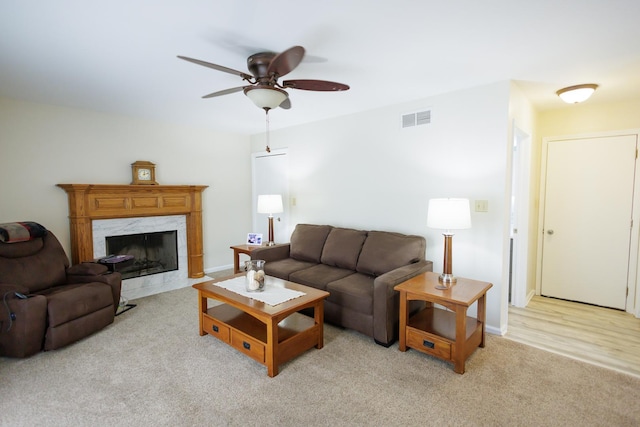 358 Princeton Ave, Bourbonnais, IL 60914 - living room with a ceiling fan, light carpet, a fireplace, and baseboards