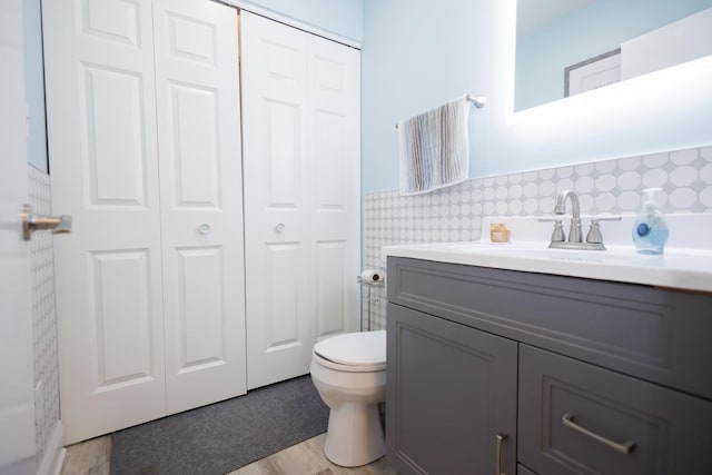358 Princeton Ave, Bourbonnais, IL 60914 - bathroom featuring a closet, toilet, vanity, wainscoting, and tile walls