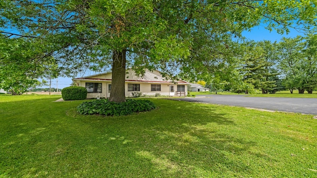 701 W Oregon St, Polo, IL 61064 - view of front of home with a front lawn and asphalt driveway