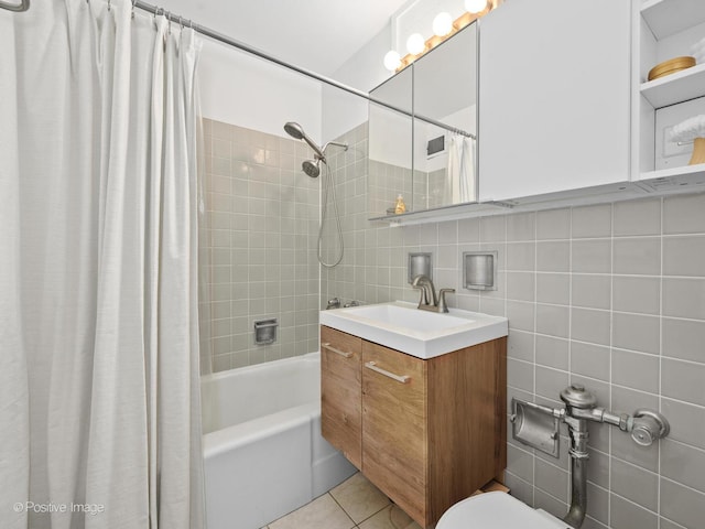 6118 N Sheridan Rd Unit 1003, Chicago, IL 60660 - bathroom with shower / bathtub combination with curtain, vanity, toilet, tile patterned flooring, and tile walls