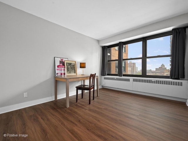 6118 N Sheridan Rd Unit 1003, Chicago, IL 60660 - office area with radiator, wood finished floors, and baseboards