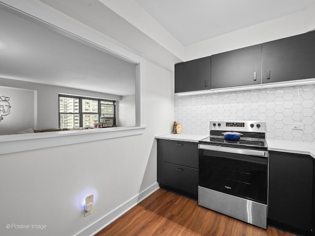 6118 N Sheridan Rd Unit 1003, Chicago, IL 60660 - kitchen with electric stove, light countertops, dark cabinets, and dark wood-type flooring