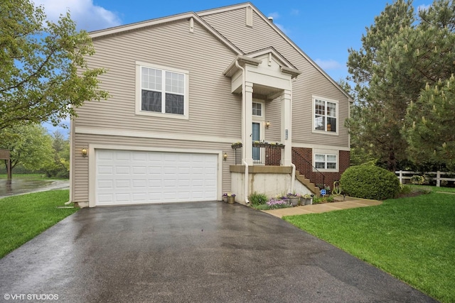 31786 N Pineview Blvd, Lakemoor, IL 60051 - view of front of house featuring driveway, a garage, and a front yard
