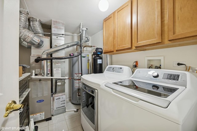 31786 N Pineview Blvd, Lakemoor, IL 60051 - laundry room featuring washing machine and dryer, cabinet space, water heater, and light tile patterned floors