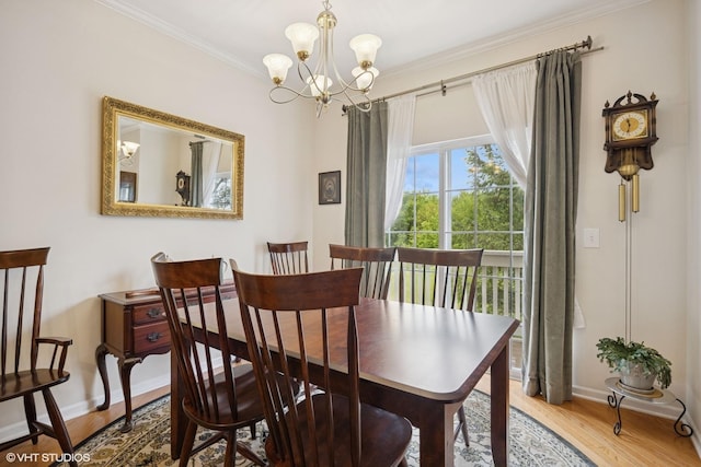 31786 N Pineview Blvd, Lakemoor, IL 60051 - dining room featuring a chandelier, baseboards, wood finished floors, and crown molding