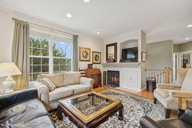 31786 N Pineview Blvd, Lakemoor, IL 60051 - living area with wood finished floors, ornamental molding, a tiled fireplace, and recessed lighting