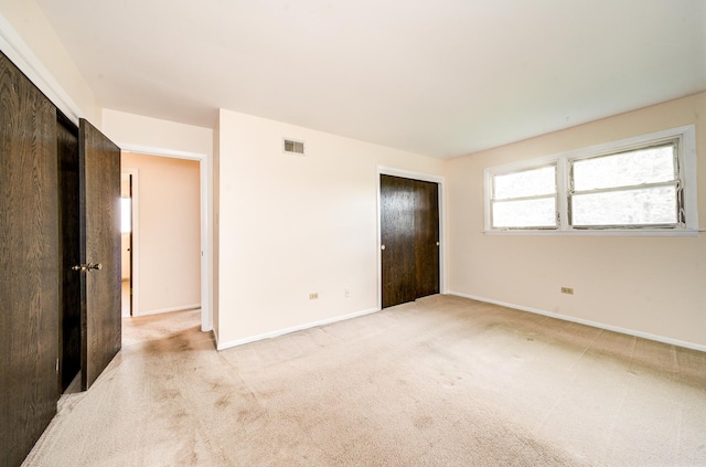 15108 Sunset Ridge Dr, Orland Park, IL 60462 - unfurnished bedroom featuring light colored carpet, baseboards, and a closet
