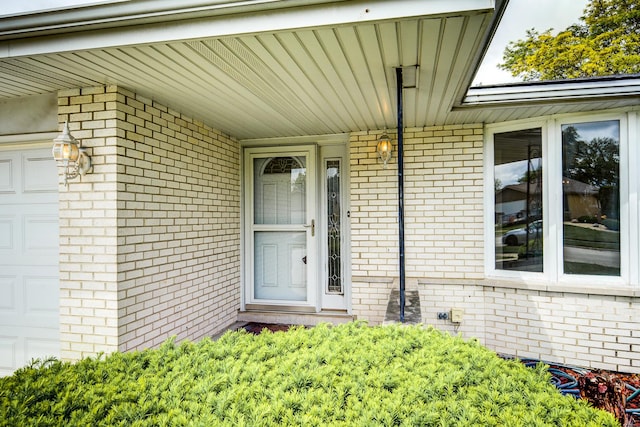 15108 Sunset Ridge Dr, Orland Park, IL 60462 - doorway to property with a garage and brick siding