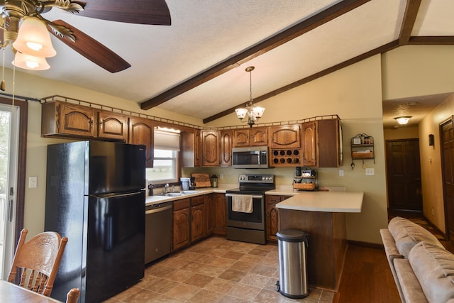 300 N Elm St, Odell, IL 60460 - kitchen with stainless steel appliances, a peninsula, light countertops, a sink, and beamed ceiling