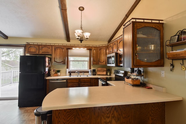 300 N Elm St, Odell, IL 60460 - kitchen featuring appliances with stainless steel finishes, a chandelier, a sink, and light countertops
