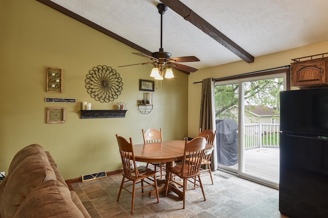300 N Elm St, Odell, IL 60460 - dining space featuring a textured ceiling, ceiling fan, baseboards, and light stone finish floors