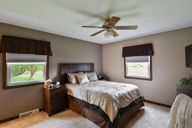 300 N Elm St, Odell, IL 60460 - bedroom featuring light colored carpet, baseboards, and ceiling fan