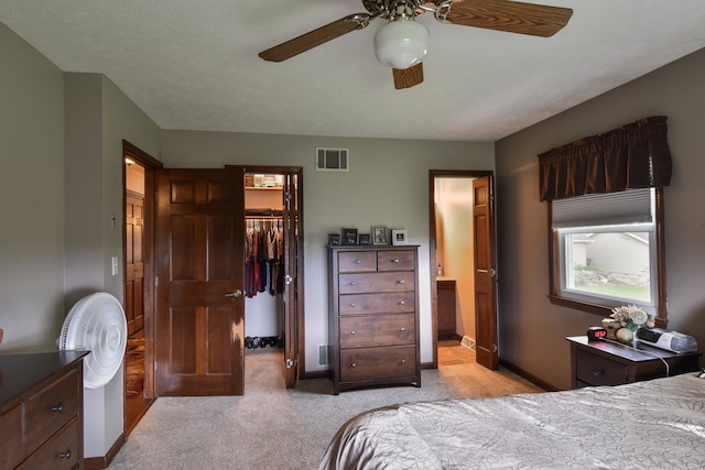 300 N Elm St, Odell, IL 60460 - bedroom featuring light carpet, a spacious closet, a closet, connected bathroom, and baseboards