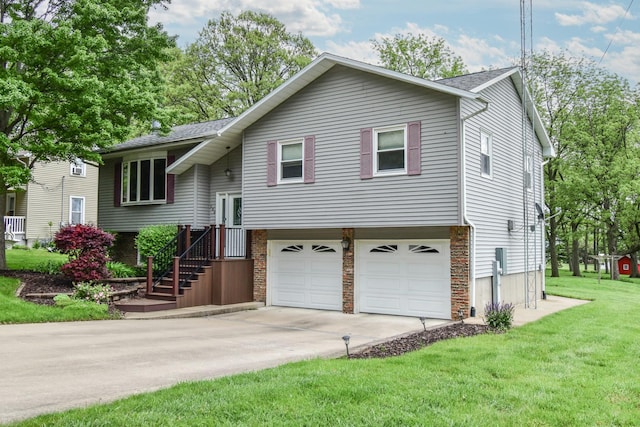 300 N Elm St, Odell, IL 60460 - split foyer home with an attached garage, a front lawn, driveway, a shingled roof, and stone siding