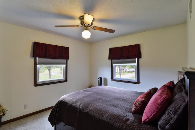 300 N Elm St, Odell, IL 60460 - carpeted bedroom featuring baseboards and a ceiling fan