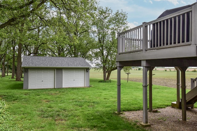 300 N Elm St, Odell, IL 60460 - view of green lawn featuring an outbuilding, a garage, and a wooden deck