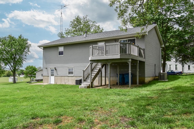 300 N Elm St, Odell, IL 60460 - back of property featuring stairway, central AC, a wooden deck, and a yard