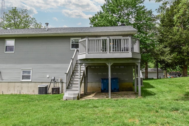 300 N Elm St, Odell, IL 60460 - rear view of property featuring stairway, a deck, a yard, central AC, and a shingled roof