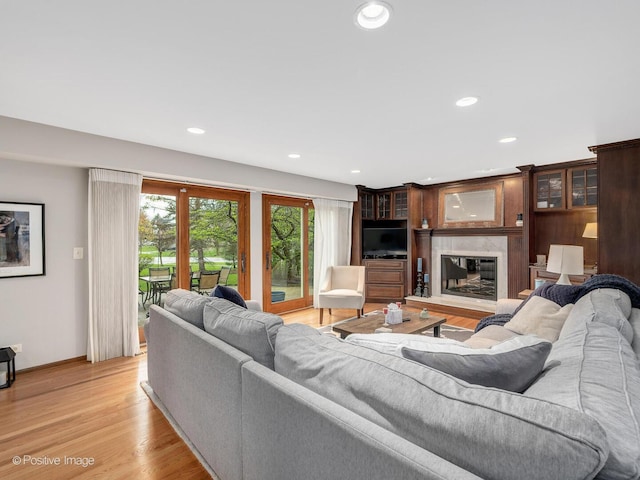 1000 Surrey Ln, Itasca, IL 60143 - living area with a large fireplace, baseboards, recessed lighting, and light wood-type flooring