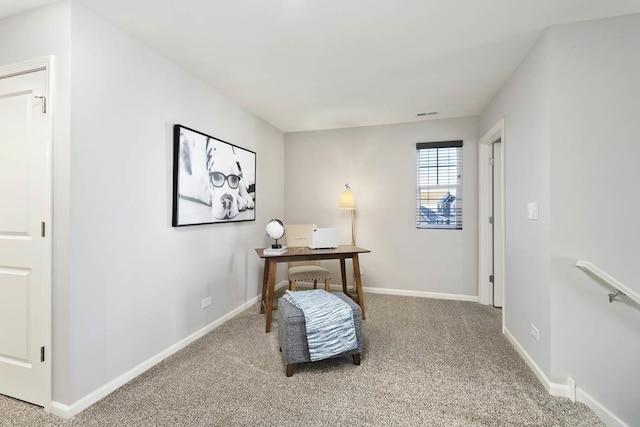office area featuring light colored carpet and baseboards
