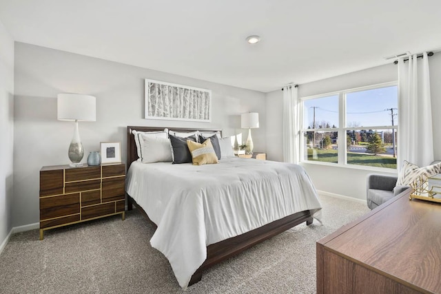 carpeted bedroom with baseboards