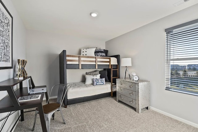 bedroom with carpet flooring and baseboards