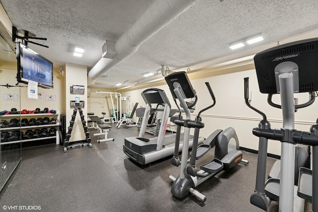 1560 N Sandburg Ter Unit 3506J, Chicago, IL 60610 - exercise room featuring a textured ceiling