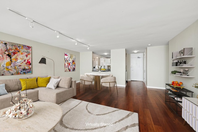 1560 N Sandburg Ter Unit 3506J, Chicago, IL 60610 - living area featuring rail lighting, wood finished floors, and baseboards
