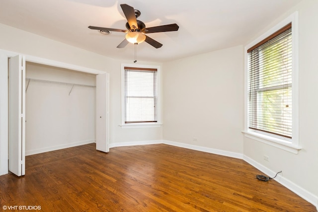 6224 N Washtenaw Ave Unit 2, Chicago, IL 60659 - unfurnished bedroom with dark wood-style flooring, a closet, baseboards, and a ceiling fan
