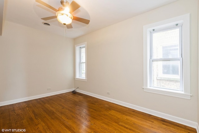 6224 N Washtenaw Ave Unit 2, Chicago, IL 60659 - unfurnished room featuring dark wood-type flooring, ceiling fan, and baseboards