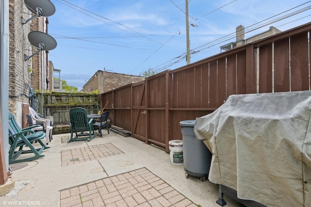 6224 N Washtenaw Ave Unit 2, Chicago, IL 60659 - fenced backyard featuring a grill and a patio