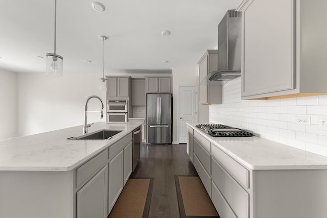 515 Watercress Dr, Aurora, IL 60504 - kitchen featuring appliances with stainless steel finishes, wall chimney range hood, gray cabinets, tasteful backsplash, and dark wood-style floors