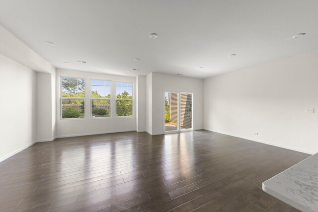 515 Watercress Dr, Aurora, IL 60504 - spare room featuring dark wood-style floors and baseboards