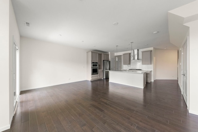 515 Watercress Dr, Aurora, IL 60504 - unfurnished living room featuring dark wood-style flooring and recessed lighting