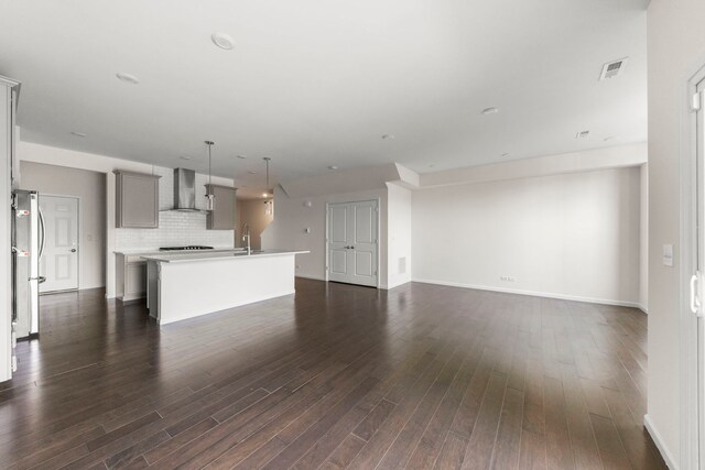 515 Watercress Dr, Aurora, IL 60504 - unfurnished living room featuring a sink and dark wood-style flooring