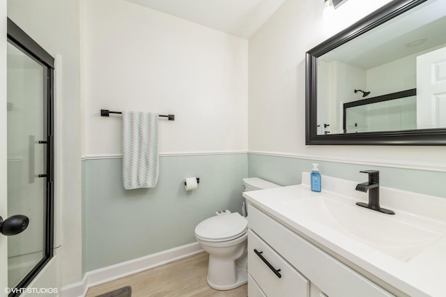 1237 Bradley Cir, Elgin, IL 60123 - full bath featuring vanity, baseboards, wood finished floors, and toilet