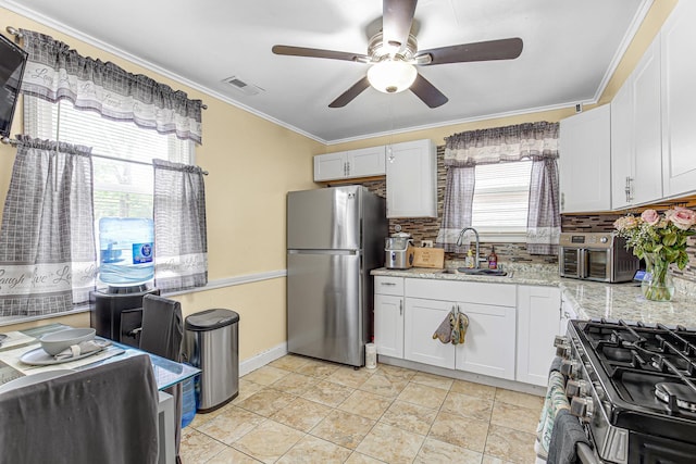 336 Niagara St, Park Forest, IL 60466 - kitchen featuring stainless steel appliances, a sink, ceiling fan, decorative backsplash, and ornamental molding