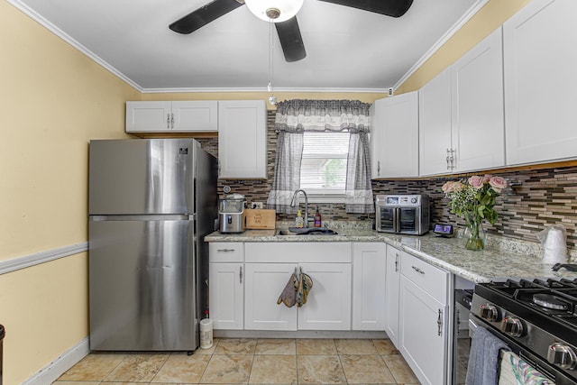 336 Niagara St, Park Forest, IL 60466 - kitchen with appliances with stainless steel finishes, a sink, crown molding, backsplash, and a ceiling fan