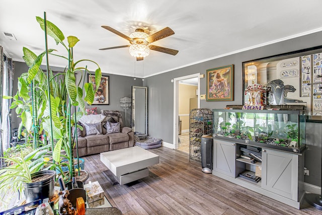 336 Niagara St, Park Forest, IL 60466 - living room featuring a ceiling fan, wood finished floors, baseboards, and ornamental molding