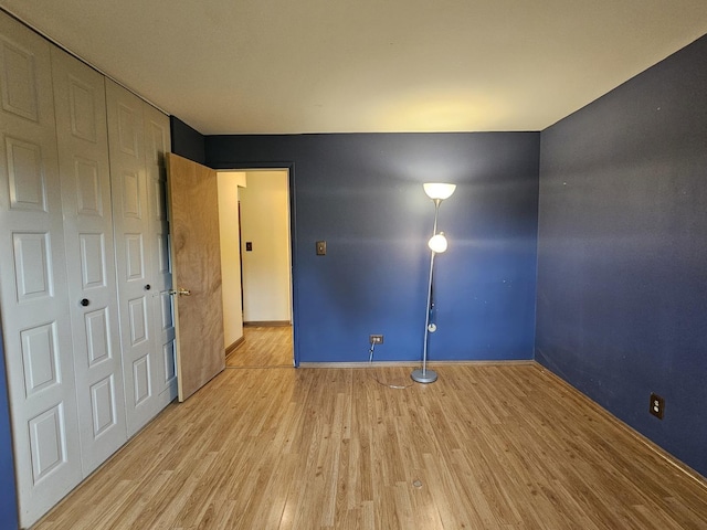 2 Oak Creek Dr Unit 3207, Buffalo Grove, IL 60089 - unfurnished bedroom with wood finished floors, a closet, and baseboards